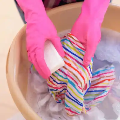 Stretching swimwear by washing with soap
