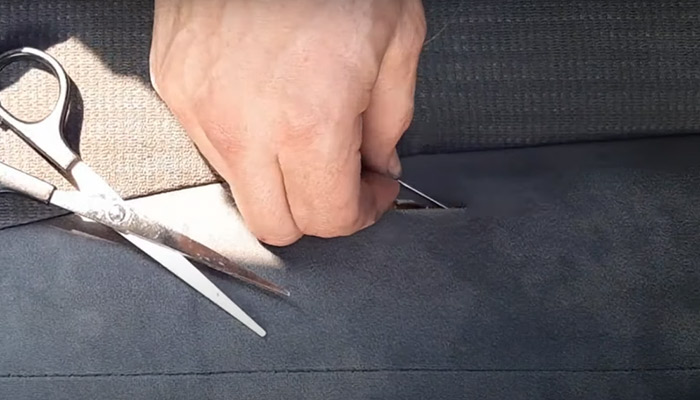 repair a ripped or torn car upholstery by hand
