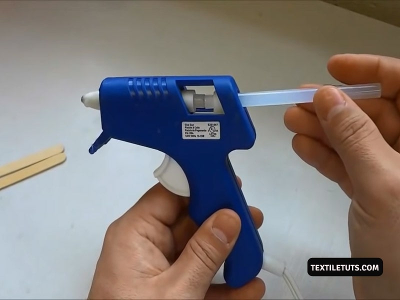 Loading glue stick into glue gun