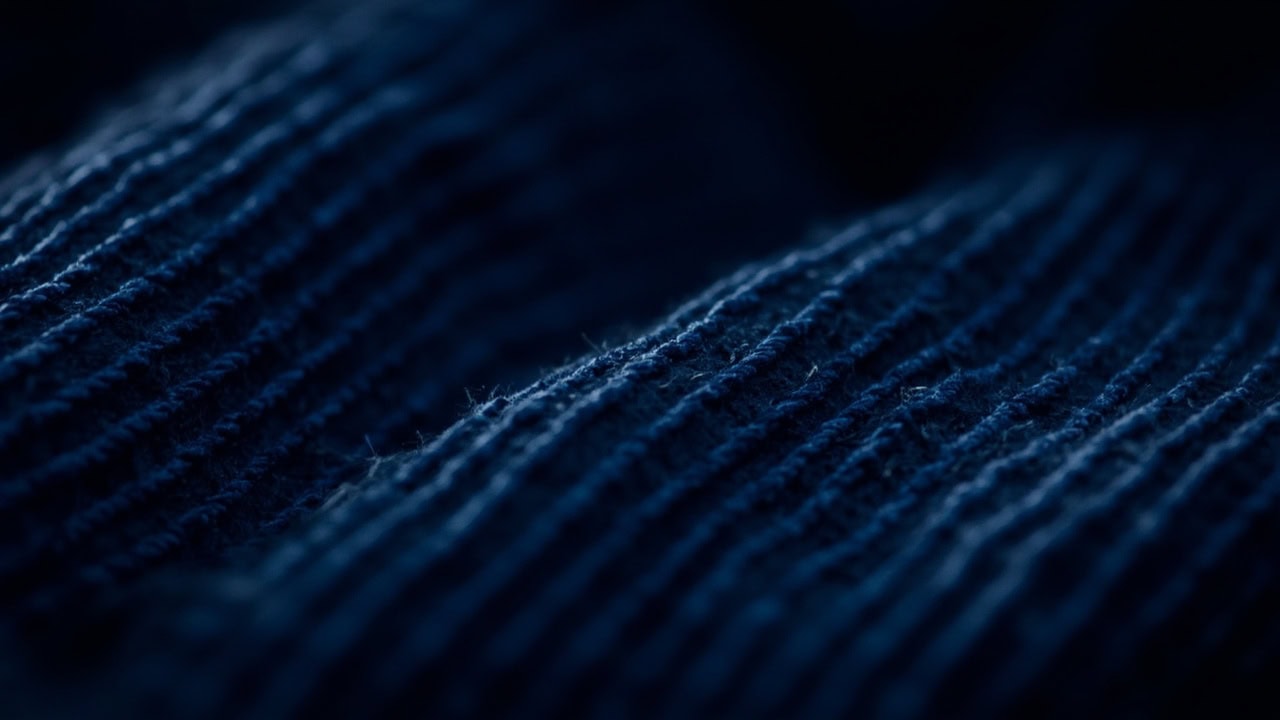 Close-up of corduroy fabric showing distinctive ridged wale pattern texture