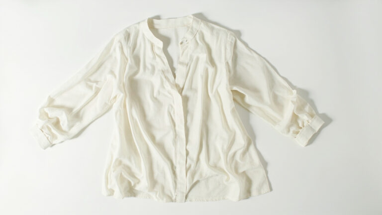 Viscose garment with measuring tape illustrating fabric shrinkage risk