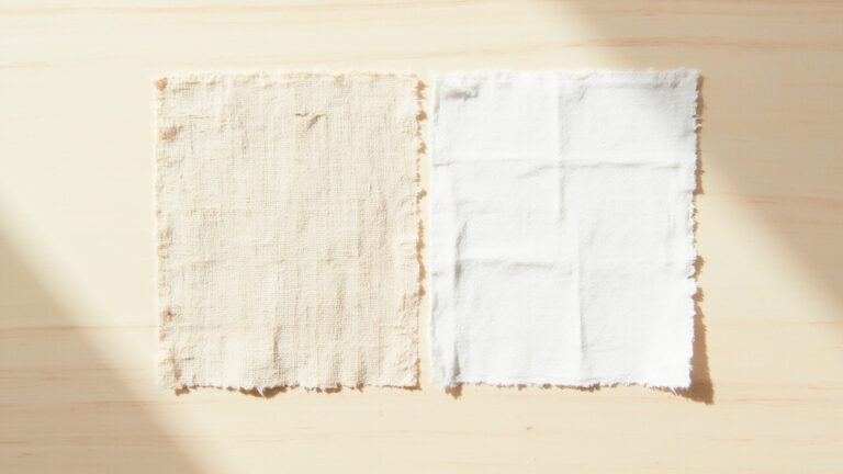 Linen fabric swatch on left compared to cotton fabric swatch on right showing weave texture differences for summer clothing