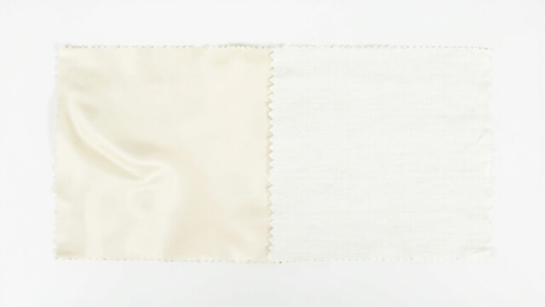 Tencel lyocell fabric beside cotton fabric showing visual texture differences in sustainability comparison