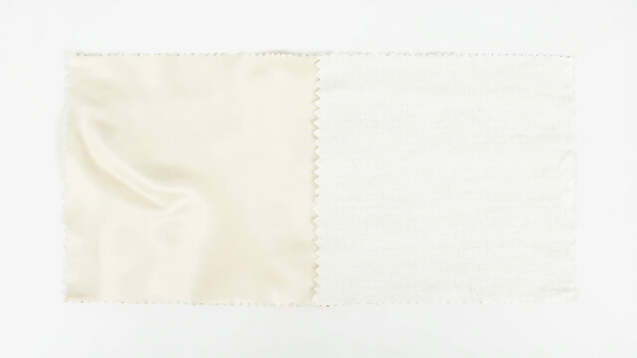 Tencel lyocell fabric beside cotton fabric showing visual texture differences in sustainability comparison