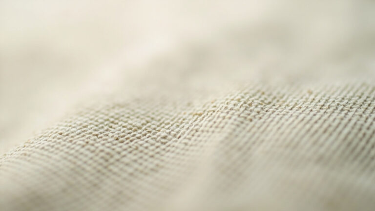 Macro photograph of twill weave fabric displaying characteristic diagonal rib pattern at 45-degree angle