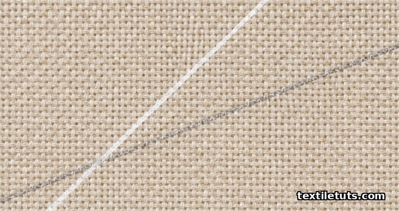 Macro view of a plain weave with chalked diagonal lines marking 45° true bias and 22.5° partial bias angles.
