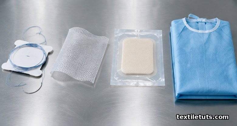 Still-life arrangement of a suture, hernia mesh, wound dressing, and surgical gown representing four medical textile categories.